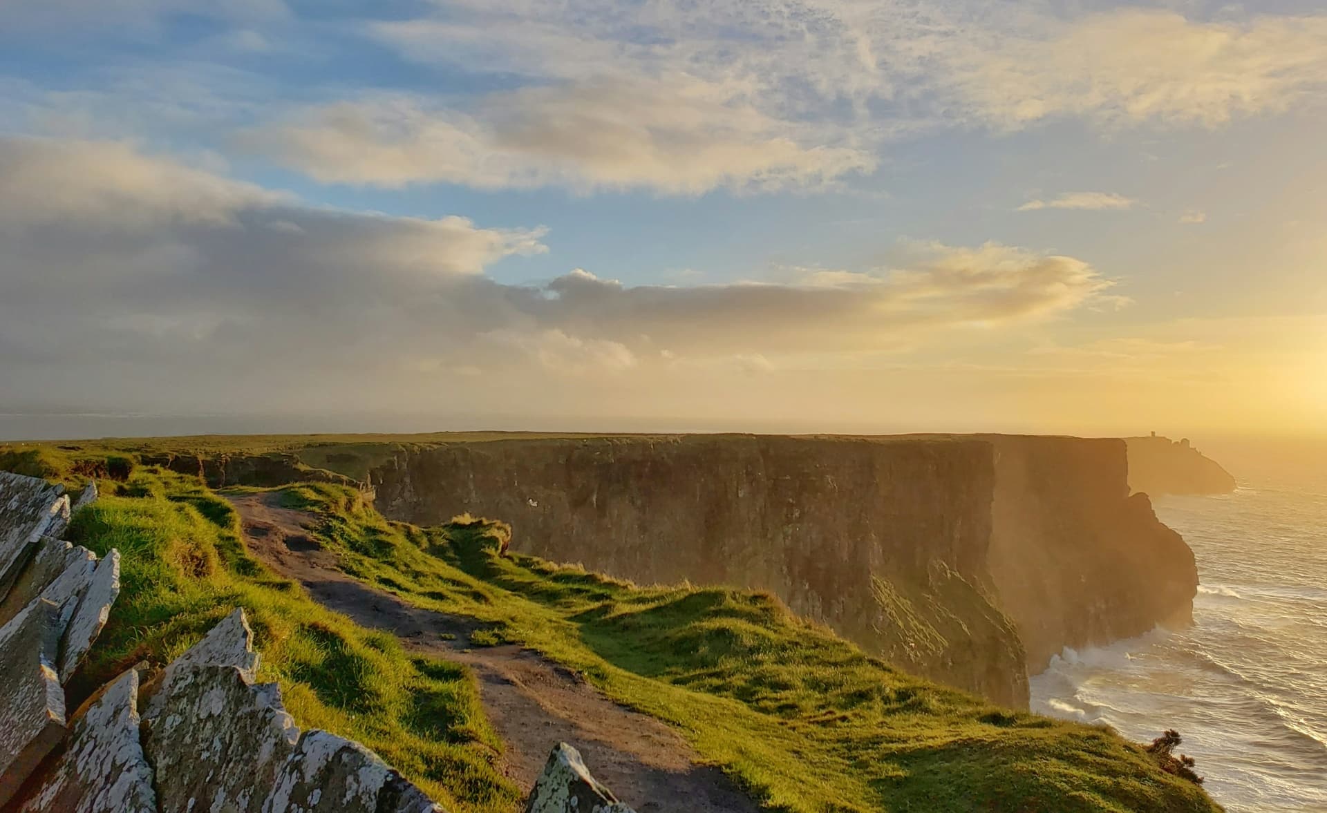 Cliffs of Moher at golden hour overlooking the Atlantic